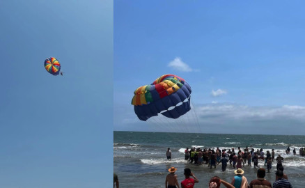 Turista queda suspendido en el aire con parachute en la playa